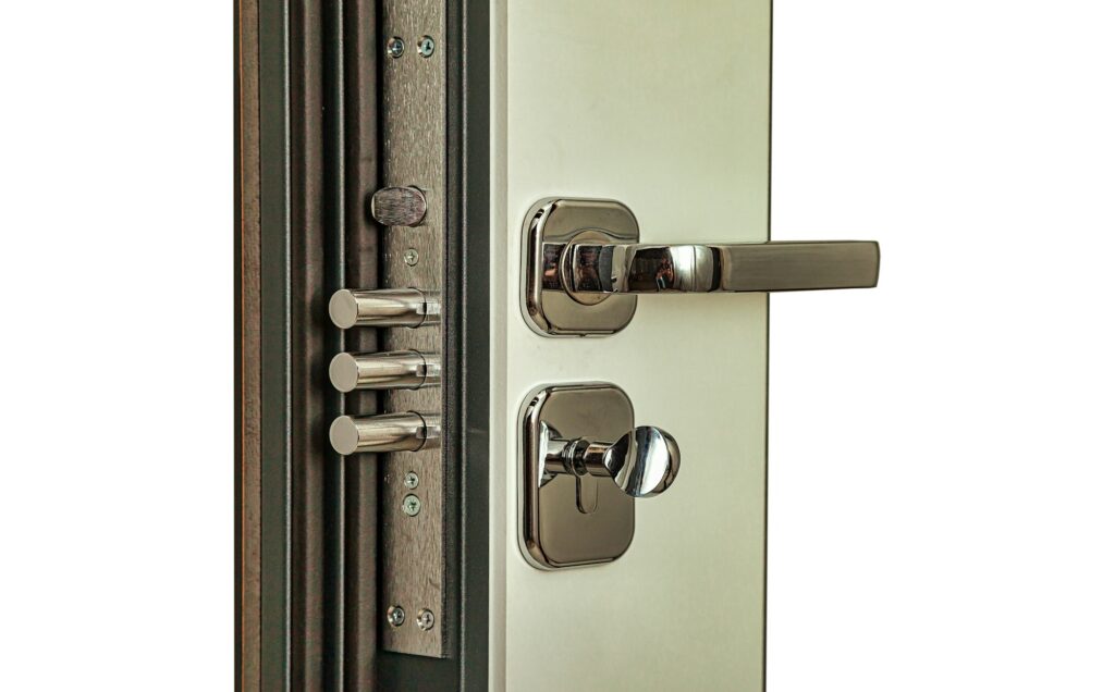 Modern armor white door with chrome metal locks and handle