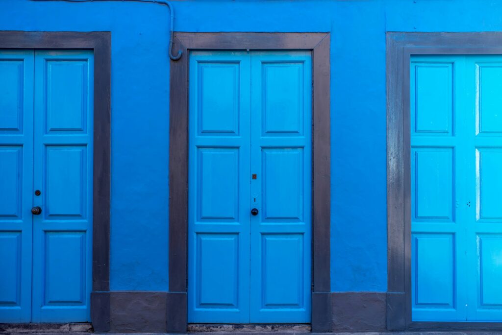 Three blue doors